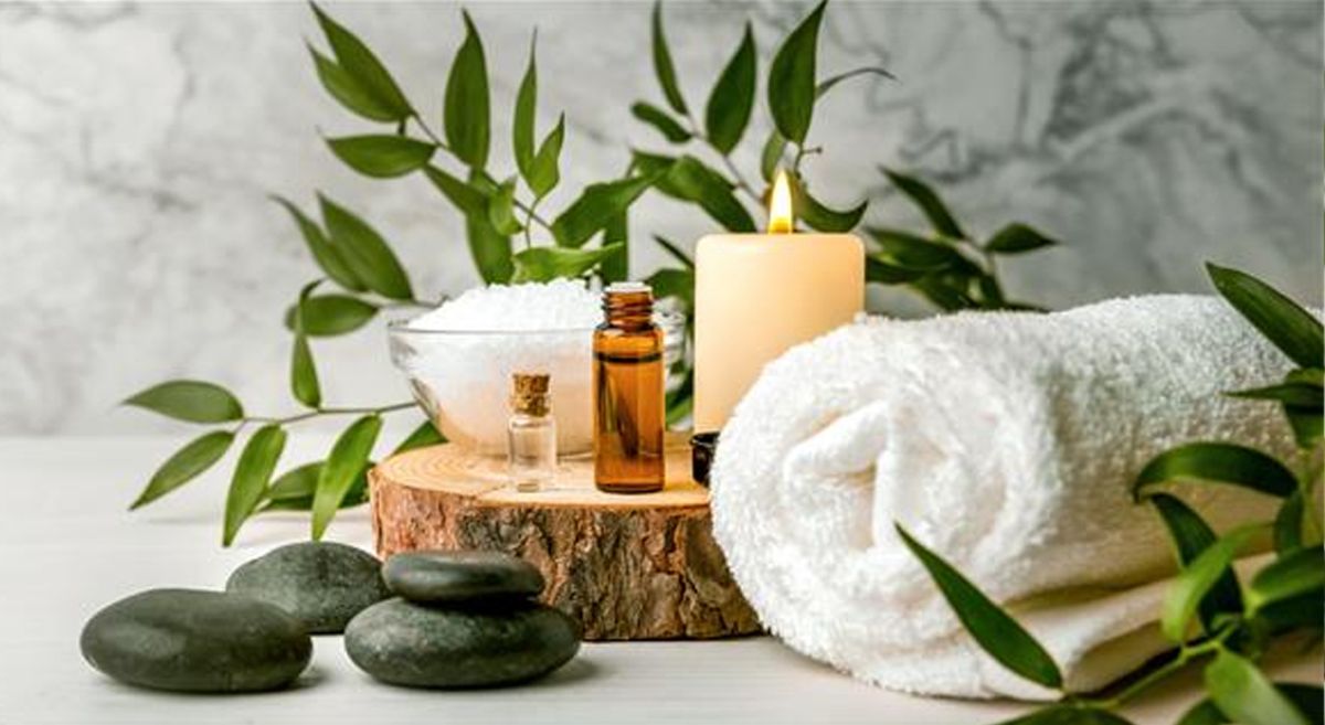 Picture of various beauty and relaxation items arranged with plants